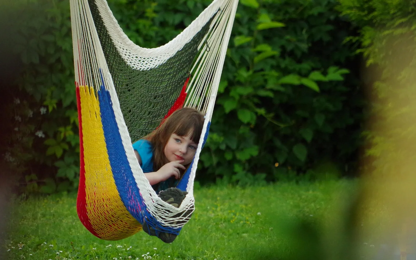 Child, hammock and garden
